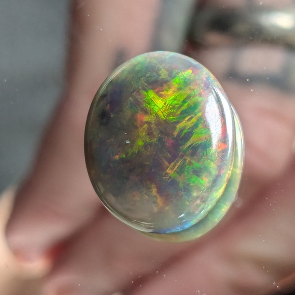 5.85ct Natural play of color black opal - Picture 10 of 16